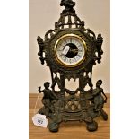 A West German ornate brass mantle clock, 36 cm.