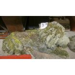 A pair of reconstituted stone lion statutes, several losses, 70 cm length. (2).