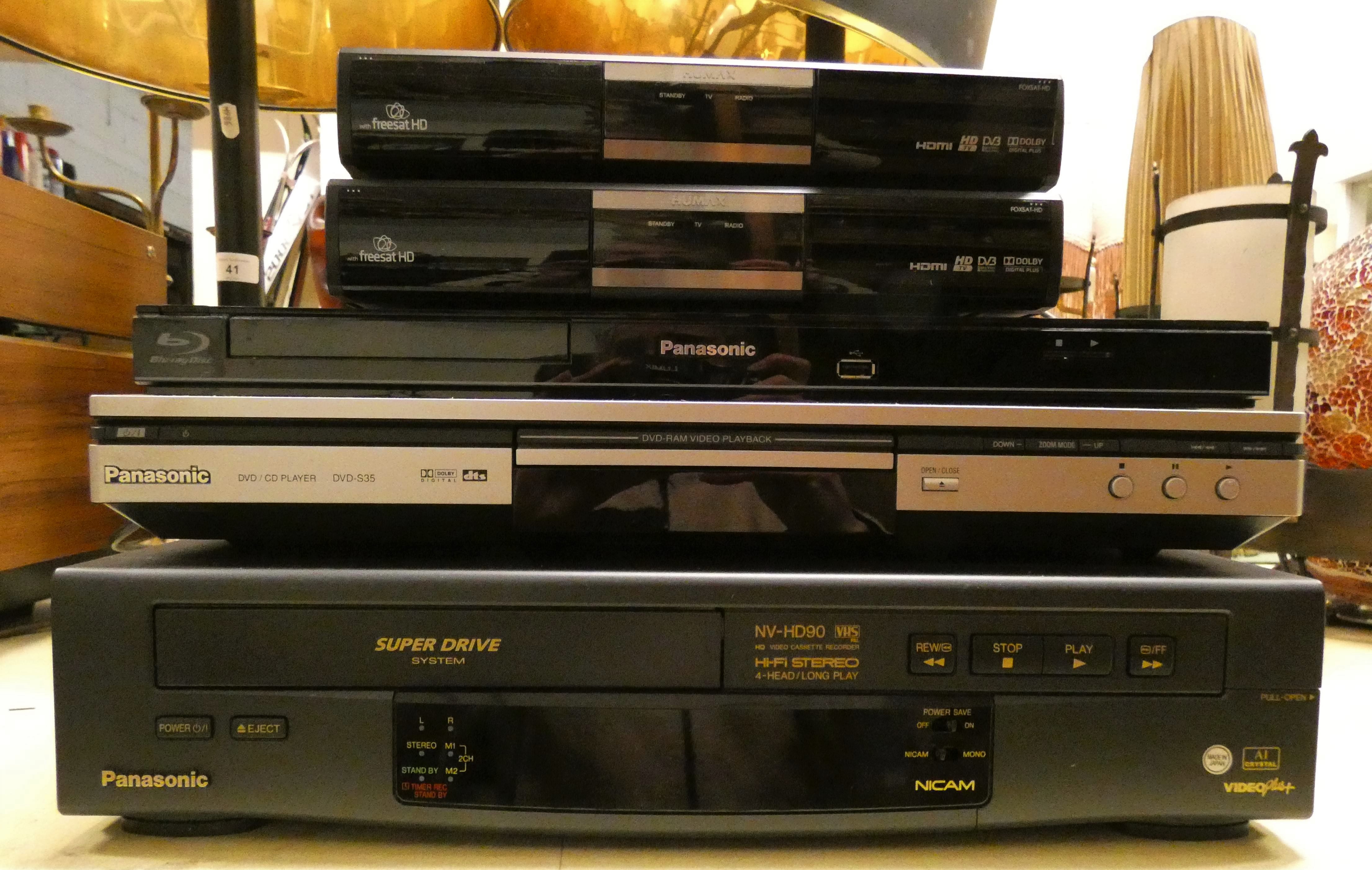 A Panasonic DVD/CD player DVD S35, a Panasonic Blue Ray player DMP DB75, a Panasonic VHS player NV