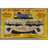 A Brimtoy clockwork train set, boxed, together with a quantity of Double O track and points.