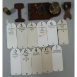 Eleven Traffolite signal lever identification plates, a wall telephone bell (without cover) and