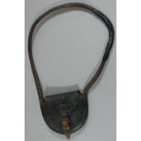 A single line leather tablet-pouch/hoop.