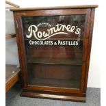 A mahogany glazed cabinet, the glass painted Rowntrees Chocolates and Pastilles