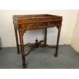 A mahogany silver table, with pierced gallery, raised on column legs, 62 x 42 cm,