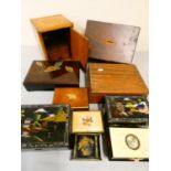 A collection of wooden and lacquered boxes.