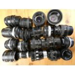 A collection of camera accessories including, Olympus, Nikon, and Canon lenses, flash units, filters