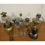 A box of oil lamp bases and chimneys, together with a box of glass shades (not matching). (2)