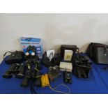 A collection of binoculars including Konica, Miranda, Bresser, Boots and Tasco.