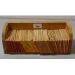 A miniature open bookshelf with a full set of 48 Bancroft Tiddlers books.