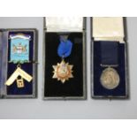 A silver and enamel jewel for Lister Lodge, a silver jewel for service to club and a medal, all