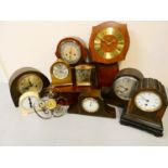 A collection of wood cased mantle clocks, carriage, and wall clocks.
