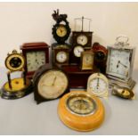 A Smiths white painted metal timing clock, a Smiths bakelite mantle clock, together with carriage,