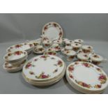 A bone china Old Country Rose style part dinner service for 6 place settings, to include dinner,