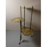 A solid brass three tier plantstand, each tier in the form of a butterfly. 76cm tall.