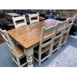 A substantial cream painted pine dining table and