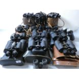 A collection of thirteen pairs of binoculars, makers to include Ross, Prinz, Miranda, and Zenith.