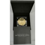 A limited edition gold plated bronze Waterloo celebration medal, case, booklet, a set of 9 silver