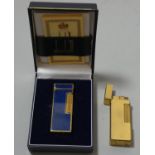 A Dunhill Rollagas lighter with gilt and lapis lazuli body, case and paperwork together with another
