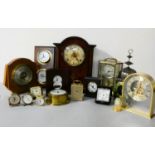 A collection of clocks and barometers, to include carriage, mantle, and wall clocks.