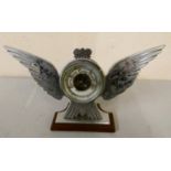 A chromed desktop barometer in the form of a bird with outstretched wings. 10cm tall 20cm wide.