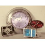 A 1950s/60s manual wind alarm clock, red plastic body with chrome stand & bezel, 8.5 cm tall,
