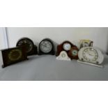 An Edwardian inlaid mohogany mantle clock, with white enameled dial & roman numerals, together
