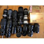 A collection of camera lenses, makers to include Canon 80-200, Pentax 80-200 and others.