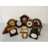 A collection of miniature, crystal glass, and novelty clocks, together with a box of mantle clocks