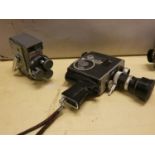 A cased Bolex Zoom Reflex cine camera, a JVC digital VHS camera, a Sony digital video camera,