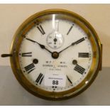 A Seth Thomas, USA two train brass bulk head clock with white enamel 6 inch dial with subsidiary