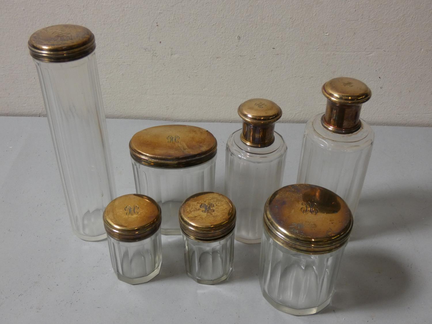 A French green leather travelling case, with fitted interior, seven silver gilt topped bottles by - Image 3 of 5