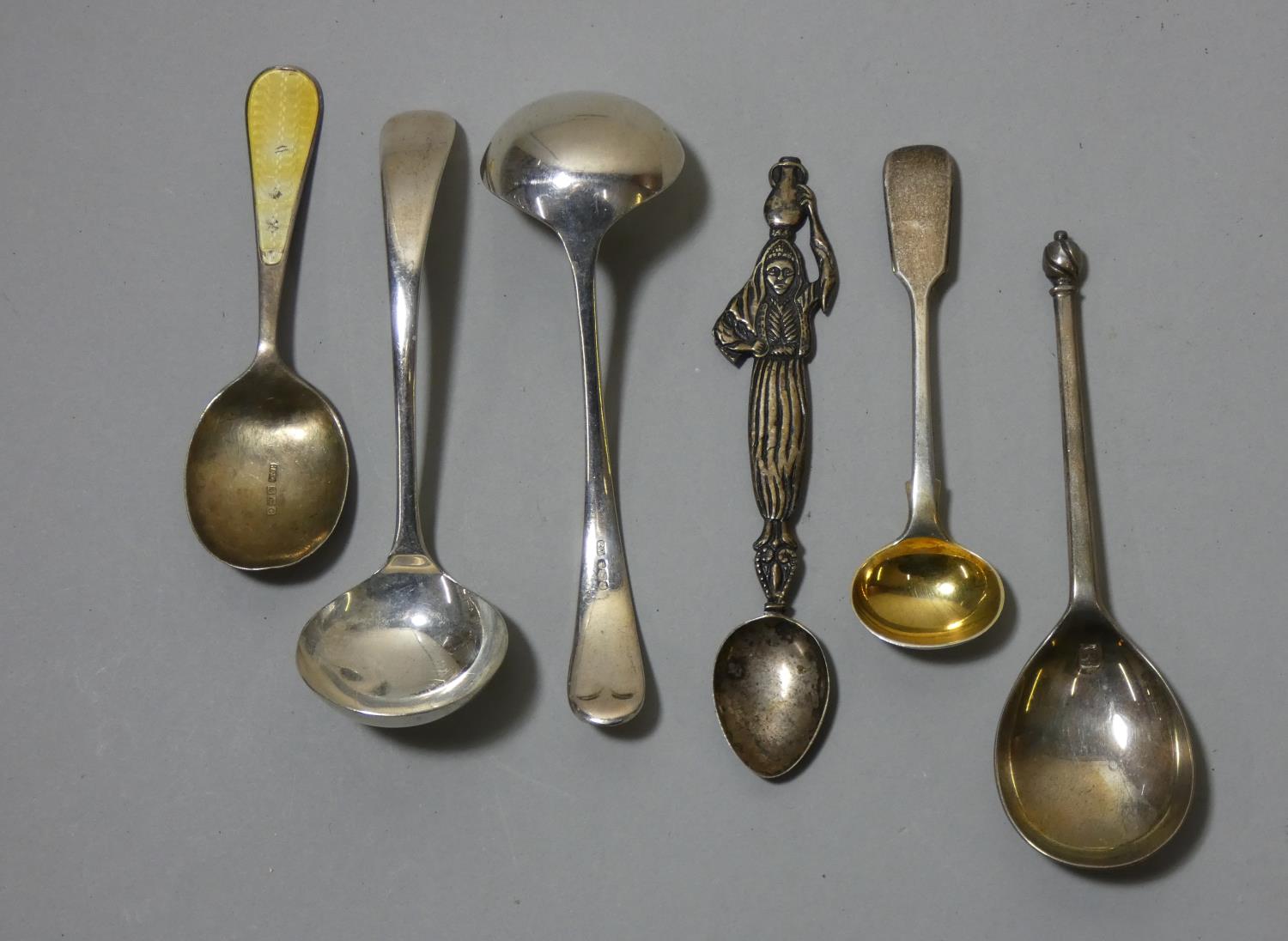 A pair of silver sauce ladles, Sheffield 1938 and 4 other silver spoons.