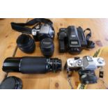 A collection of cameras to include, Konica Autoreflex T3, Canon EOS 350D, Ricoh Mirai.