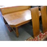 A mahogany extending dining table raised on turned supports and stretchers, 113 x 170 cm extending