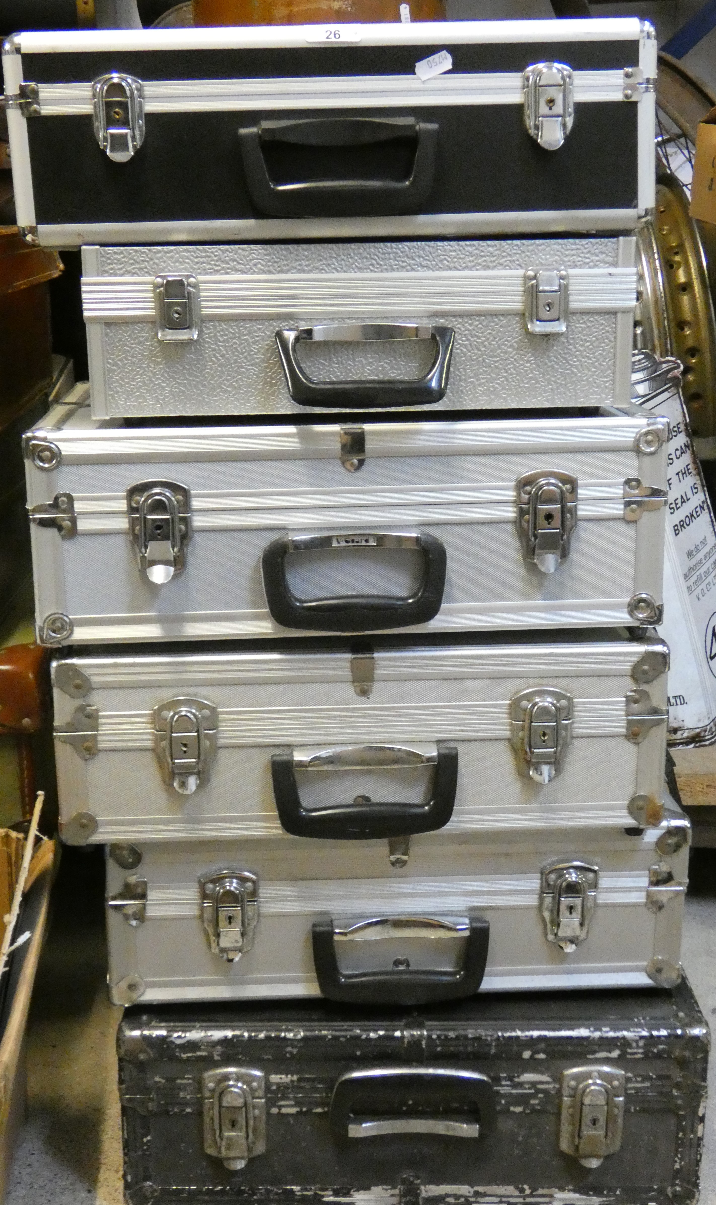 4 alloy camera cases together with 2 other camera cases