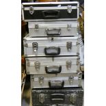 4 alloy camera cases together with 2 other camera cases