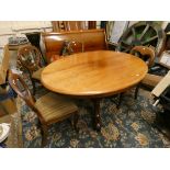 A Victorian oval mahogany tilt top dining table, raised on a tripod base, 140 x 104 cm, together