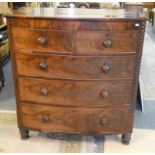 A Victorian bow front chest of two short over three long drawers with spiral turned corners,