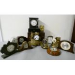 A collection of various mantle clocks including carriage, slate, anniversary, and gilt metal.