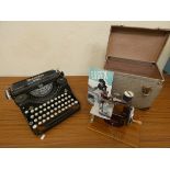 An early Mercedes Prima typewriter and a cased miniature Essex sewing machine. (2)