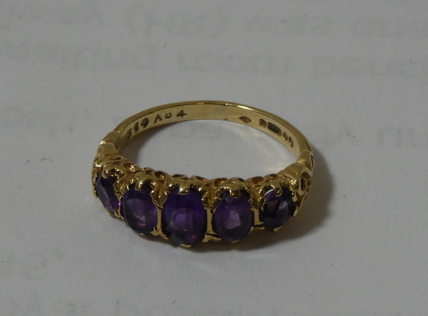 A 9ct gold 5 stone ring, size L, 3.1 gms.