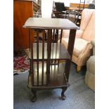 A marquetry revolving library bookcase, raised on cabriole support, 88 cm high.