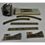 A collection of Hornby Dublo O 3rd rail track and a power unit.