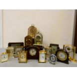 A collection of mantle, carriage, anniversary, and electric clocks and barometers. (3)