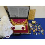 Masonic regalia to include briefcase and contents, apron, gloves, scarf, jewels and a tin sheet