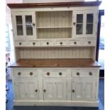 A cream painted pine dresser.