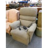 An electric reclining armchair in beige fabric.