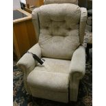 An electric reclining armchair in beige fabric.
