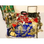 A collection of costume jewellery, including a cased set of white metal decorative pins, and a