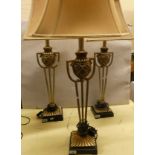 A set of three white metal table lamps, two with matching shades. 90cm tall. (3)